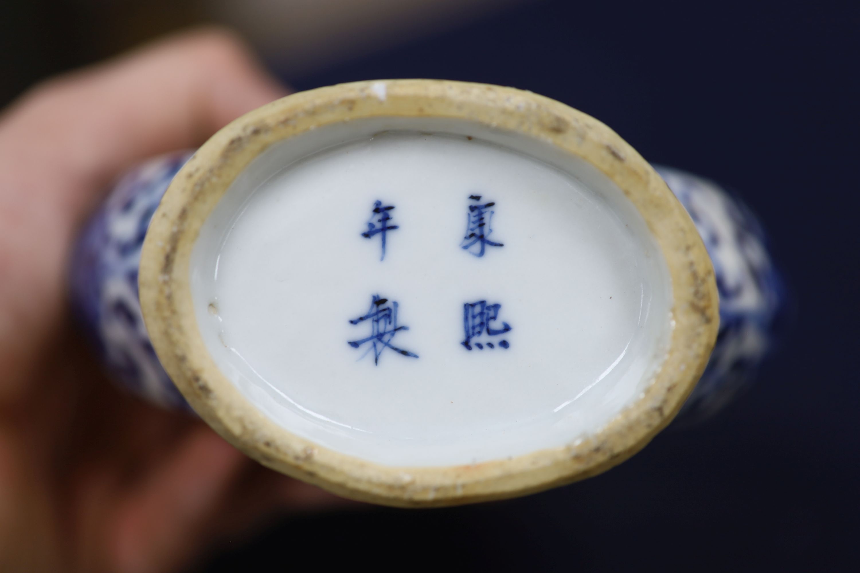 Two 19th century Chinese blue and white moon flasks and a teapot, tallest 21cm